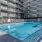 Resort-style swimming pool with lounge seating