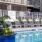 Resort-style swimming pool with lounge seating
